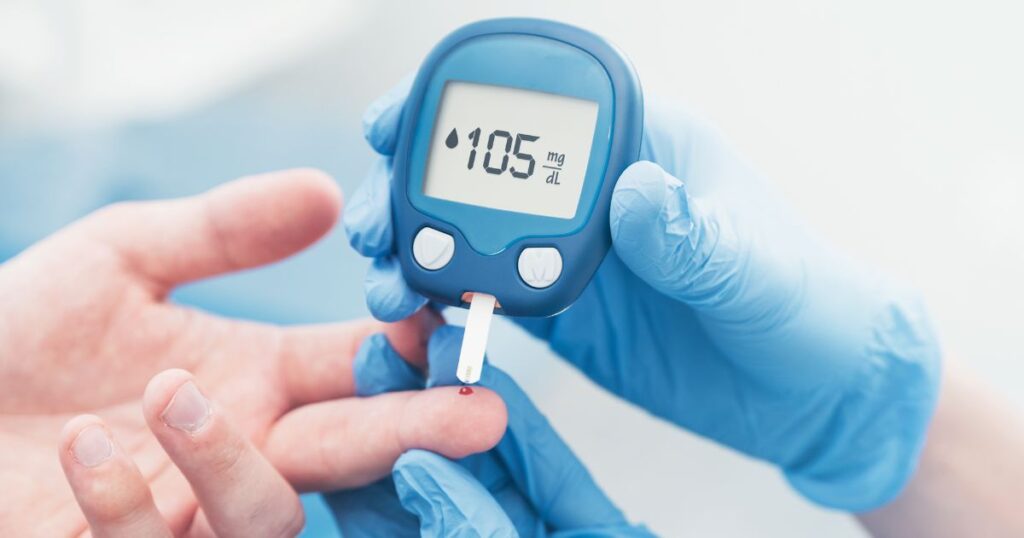Doctor Checking Blood Sugar Level with Glucometer
