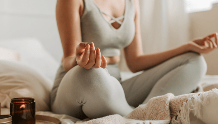 Woman Meditating at Home